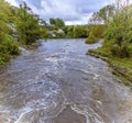 A view from Cenarth down the river Teifi, Wales after heavy rainfall Royalty Free Stock Photo