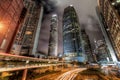 View of Central Hong Kong City Skyline with Busy Roads and Streaks of Car Lights at Night Royalty Free Stock Photo