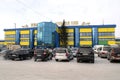 View of central market building with parking in front of it in Kokshetau, Kazakhstan.