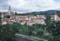 View of Cesky Krumlov with the round painted tower of its Castle. Cesky Krumlov is one of the most picturesque towns in the Czech