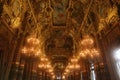 View of the chandeliers hanging in the Paris Opera brightening the interior with paintings Royalty Free Stock Photo