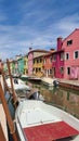 View of the channel of the island of Burano, colorful houses of the island of Burano, Italy