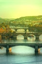 View of Charles bridge and the old town of Prague in Czech Republic, at the banks of Vltava River under the sunset