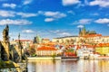 View of Charles Bridge, Prague Castle and Vltava river in Prague, Czech Republic.Nice sunny summer day with blue sky and clouds.