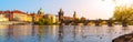 View on Charles bridge and Swans on Vltava river in Prague at sunset, Czech Republic Royalty Free Stock Photo