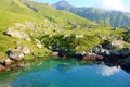 View on Chaukhi mountain pass from Abudelauri Blue Lake in Caucasus mountains, Georgia