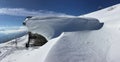 chalet coverd with snow on alpine mountain with touring ski on the snow Royalty Free Stock Photo