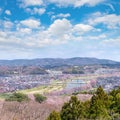 View of Cherry Blossom or Hitome Senbon Sakura festival at Shiroishi riverside and city, Funaoka Castle Ruin