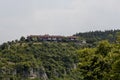 View of Cherven village, Bulgaria, located below, above and in the high limestone cliffs
