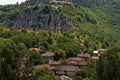 View of Cherven village, Bulgaria, located below, above and in the high limestone cliffs