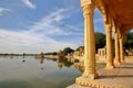 View of chhatris through arches and columns at Gadi Sagar lake, Jaisalmer, Rajasthan, India