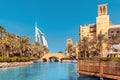 View of the chic seven star hotel Burj al Arab in the shape of a sail and the artificial canal Royalty Free Stock Photo