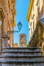 View of chiesa santa maria dell ammiraglio through a narrow street in Palermo, Sicily, Italy Royalty Free Stock Photo
