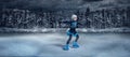 Child figure skater on winter lake  background Royalty Free Stock Photo