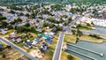 View of Chincoteague Island and the road along the bay. houses and motels with parking lots. View from above