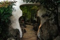 A view of Chinese styled gate in a shape of vase in the Chinese garden with bamboo trees