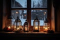 view of christmas lanterns glowing in window of peaceful cottage Royalty Free Stock Photo