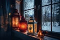 view of christmas lanterns glowing in window of peaceful cottage Royalty Free Stock Photo