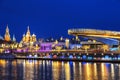 View of Christmas Moscow with a soaring bridge over the Moscow river, new year installations in the form of glowing trees, colorfu