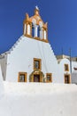 A view of a church bell tower in the village of Emporio, Santorini