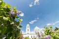 A view on the church between of the branches of lilac