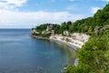 View of the church at Hojerup on top of the white chalkstone cliffs of Stevns Klint Royalty Free Stock Photo