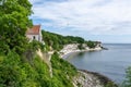 View of the church at Hojerup on top of the white chalkstone cliffs of Stevns Klint Royalty Free Stock Photo