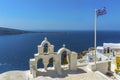 A view from church roof tops in the village of Oia, Santorini looking towards Thirasia island