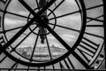 View of church Sacre Coeur in Montmartre through a large Clock from Museum d`Orsay in Paris