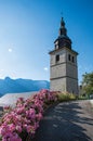 View of church steeple and flowers in the medieval village of Conflans Royalty Free Stock Photo