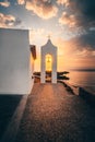 View through the church tower of the typical Greek church Chapel of Agios Nikolaos on Zakyntos, on the sunrise at the sea Royalty Free Stock Photo