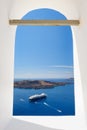 View through church window in Fira to caldera sea, Santorini Royalty Free Stock Photo