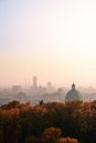 View from Cidneo Hill top to silhouette of skyscrapers in business part of Brescia and dome of New Cathedral