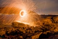 View of circle fire sparks over rocks Royalty Free Stock Photo