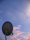 View of a circular satellite television antenna.