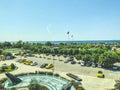 View of the city from above. exotic, tall, green trees in the city center. palm forest, amusement park in the city. against the Royalty Free Stock Photo