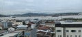 View of city buildings and cloudy sky on mahakam river, Samarinda, Indonesia