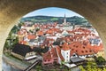 View of the city of Czech Krumlov from the opening in the wall of Cesky Krumlov castle. Royalty Free Stock Photo