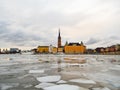 View of the city of Gamla Stan in Stockholm & x28;Sweden& x29; during winter with the frozen river Royalty Free Stock Photo