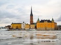 View of the city of Gamla Stan in Stockholm Sweden during winter with the frozen river Royalty Free Stock Photo