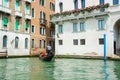 View of the city Grand Canal in Venice in a sunny day. Gondolier driving the gondola in Venice, Italy Royalty Free Stock Photo