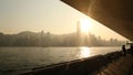 Hong Kong, China - January 1, 2016: View of the city of Hong Kong and the sea in the rays of the sunset from the harbor Royalty Free Stock Photo