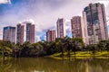 View of the city, modern building between the sky and a lake