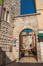 View of city portal in stones and wall in Vence.
