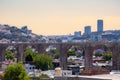 View of the city of Queretaro Mexico aqueduct with jacaranda tree Royalty Free Stock Photo