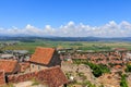 View of the city of Rasnov from the territory of the medieval fortress Rasnov Citadel in the mountains of Transylvania. Romania Royalty Free Stock Photo