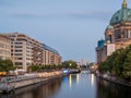 View of the city river at the cathedral in Berlin at sunset.