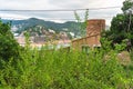 Tossa de Mar, Spain, August 2018. View of the city from the mountains through the shrubbery. Royalty Free Stock Photo