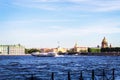View of the city`s sights across Neva River. St. Isaac`s Cathedral, Rostral Columns, steeple of the Admiralty, Vasilievsky Isla Royalty Free Stock Photo