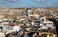 View of the city of Seville (Spain) with snow-white houses and churches against a blue sky with clouds Royalty Free Stock Photo